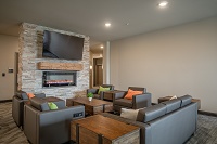 Hidden Creek Residences - Cozy up by the Fireplace in the Phase 3 Community Room 
